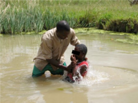 Figure 2: Full immersion Christian water baptism. Credit: DailyAdvent